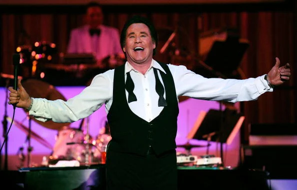 Wayne Newton performing live in Las Vegas, showcasing his charisma and legendary status.