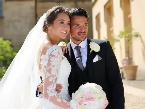 Emily Compagno with her husband Peter Riley outdoors.