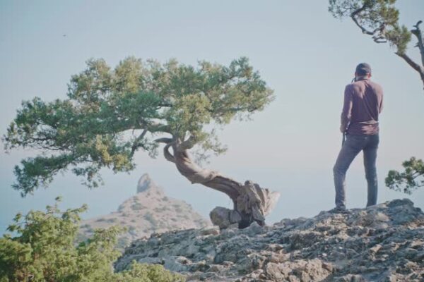 A couple sharing a spontaneous moment of connection in a scenic outdoor setting, symbolizing Atlas Eros.