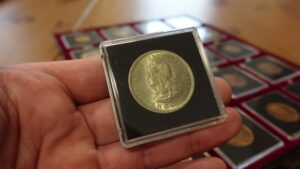 Rare coins displayed on a collector’s table from Coyyn.com.