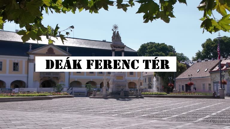 Bustling view of Deák Ferenc Tér in Budapest with surrounding buildings and people enjoying the square